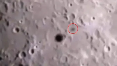 Disk UFO flies across the Moon leaving a huge shadow.