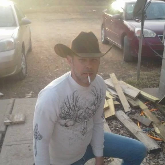 4/5 Cowboys Smoking Cigarettes