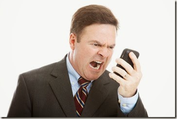 Angry Businessman Yelling into Phone