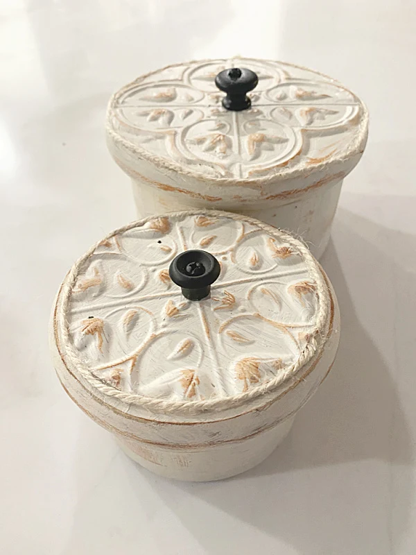 round boxes with tin ceiling lids