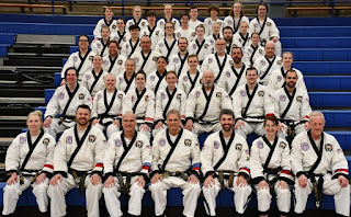 Martial arts black belts at a tournament