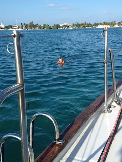 Nan paddling laps around anchored Whispering Jesse