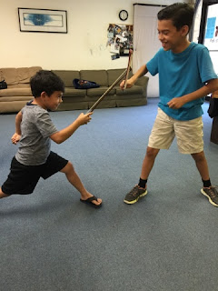 students use violin bow as fencing epee or sword