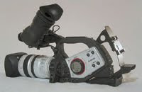 a Canon XL2. This is a 3CCD (broadcast quality) camera. It utilized Mini DV tapes, and had so many buttons, I can't begin to tell you what they all do.