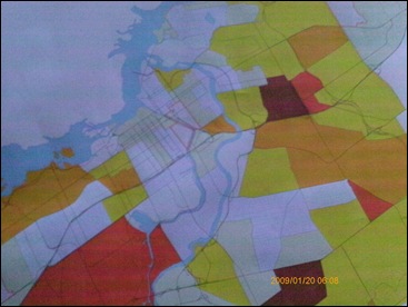 The colours represent numbers.  The darker the colour the higher the number, eg brown equals 600+ children in low income families that live in that area - there's more to this map that's not been depicted in this photograph