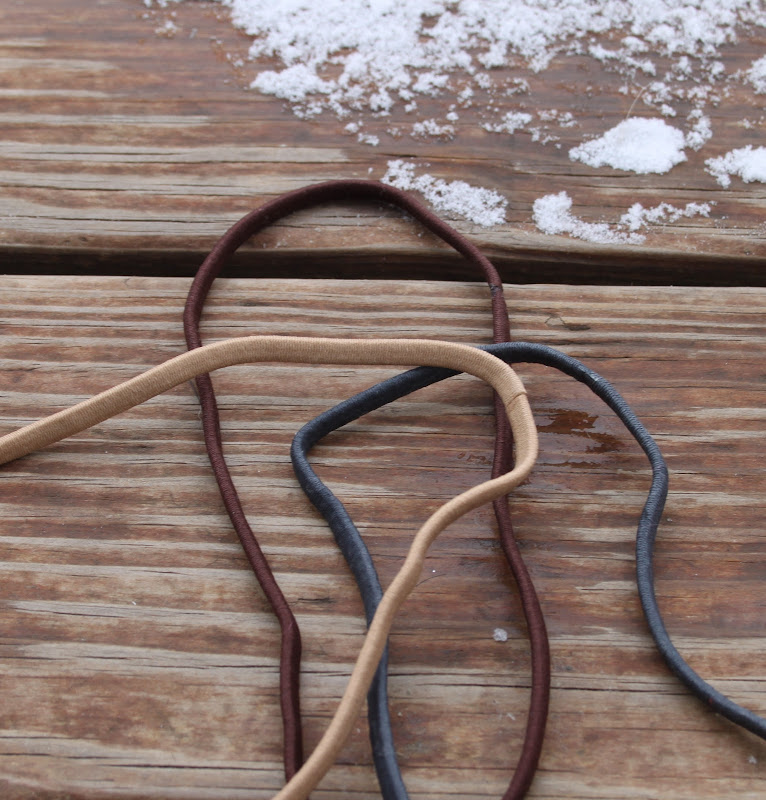 Super skinny elastic headbands in tan, brown, and gray. These fit  title=