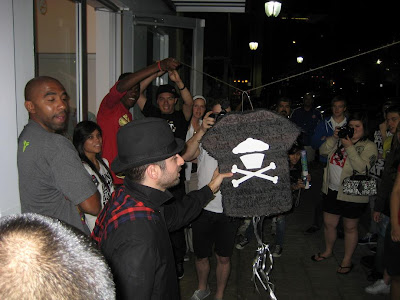 Johnny Cupcakes About To Swing At A Fan's Johnny Cupcakes T-Shirt Piñata