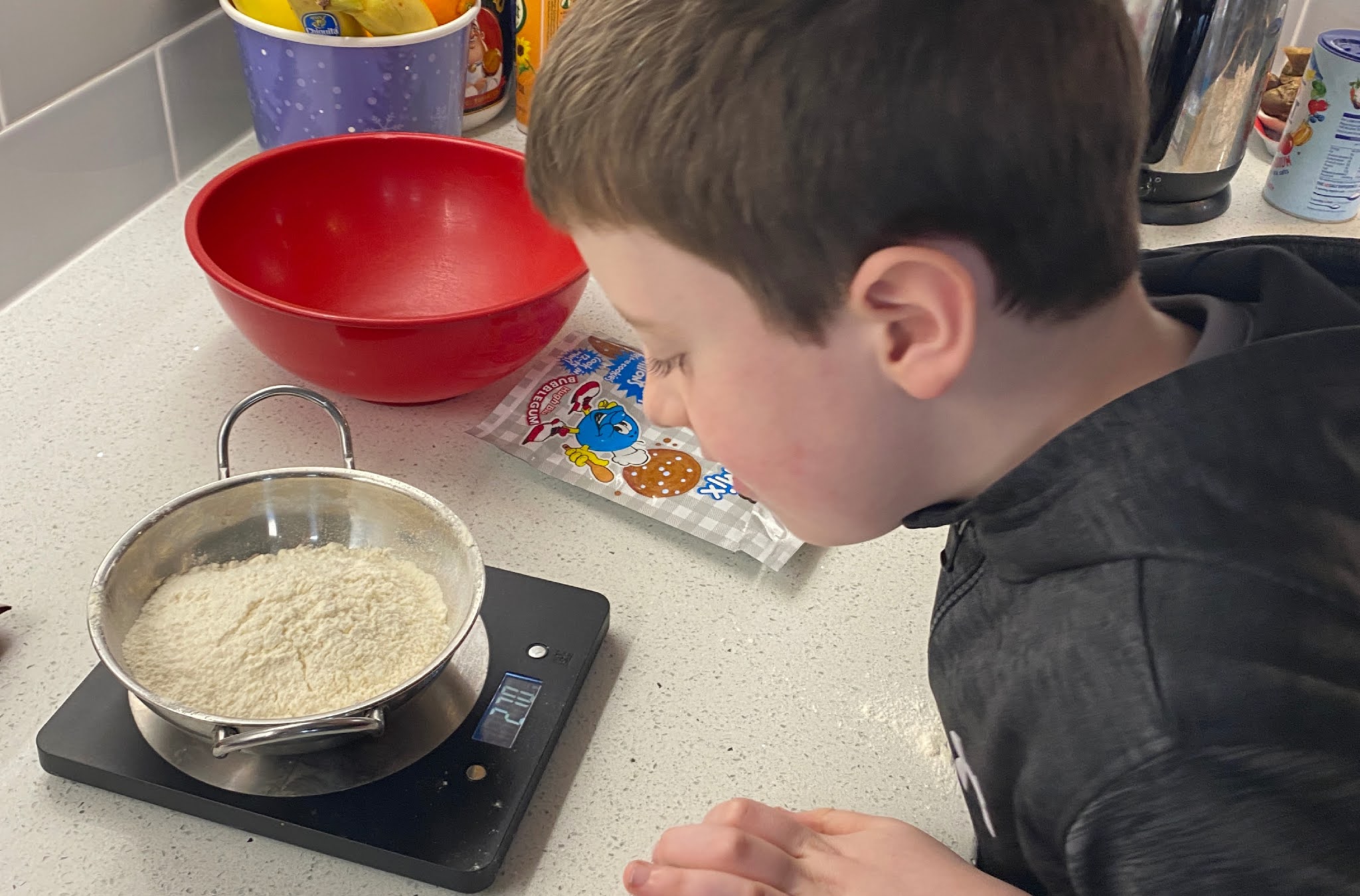 boy measuring out ingredients