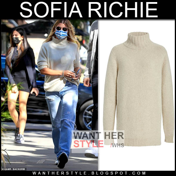 Sofia Richie in cream knit turtleneck sweater and white boots