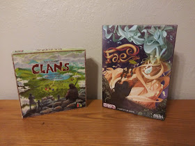 The boxes for Clans (artwork showing some prehistoric people on a hill looking down into a valley with several huts in various colours) and Fae (artwork showing a cloaked figure with a primitive staff holding his arm up towards a faerie creature).