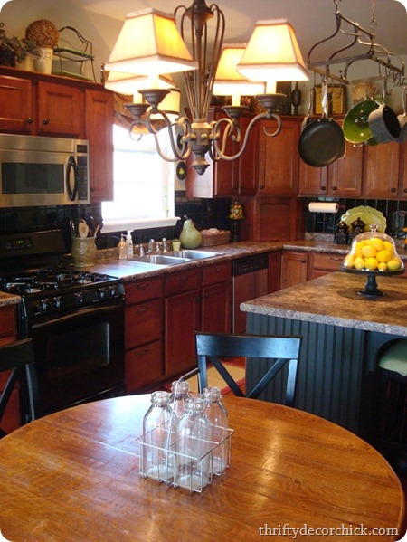 black backsplash, wood cabinets