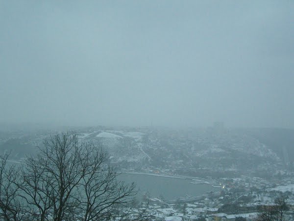 An Istanbul bay and hills in a snowstorm.