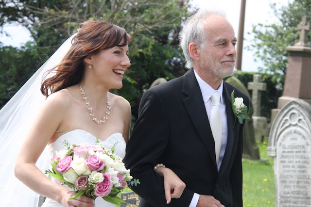 Joanne's wedding bouquet was in shades of pinks ivories and vintage pinks