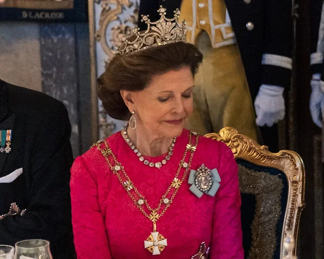 Queen Silvia wore a Padme pink gown by Georg et Arend. Princess Victoria wore a feather cape gown by Toteme