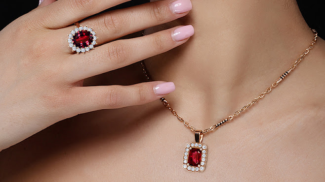 a woman wearing ruby jewelry