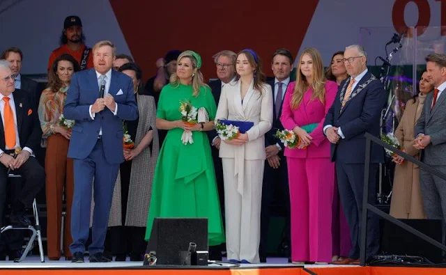Princess Amalia wore a fuchsia red suit by Marina Rinaldi. Princess Ariane wore a suit by Max & Co. Maxima wore a dress by Natan