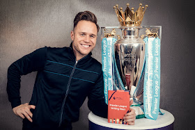 Olly Murs Premier League trophy and book for writing stars campaign