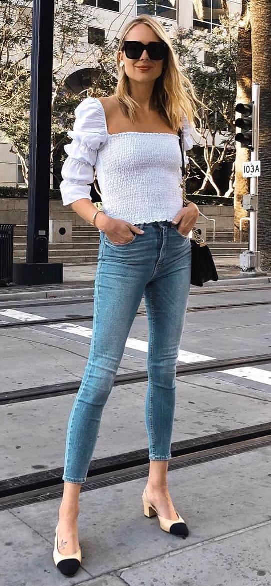 what to wear with a pair of skinny jeans : white ruffle top + bag + heels