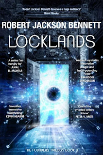 Cover for book “Locklands” by Robert Jackson Bennett. The overall colour scheme is blue – varying form turquoise to deep purple and black It’s a door. A door flung is open to the left. Cryptic symbols are zooming through the door, emerging from a space beyond, which is a bright white-blue and in the midst of which float an enormous, blazing white eye, with in inky black pupil which contains stars. The door itself is sturdy and solid, and it is set in a stone wall adorned with many arches and carvings, including, above the lintel, a skull.