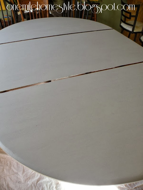 Dining table with second coat of paint