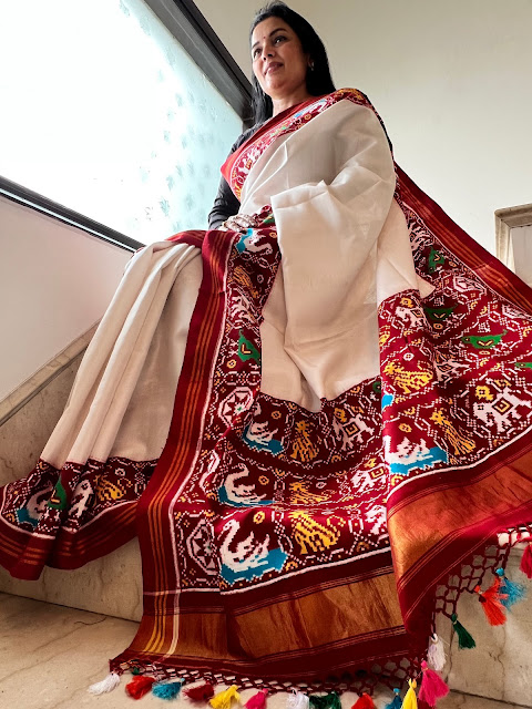 White double ikat patan patola complete with multicolour tassels on pallu