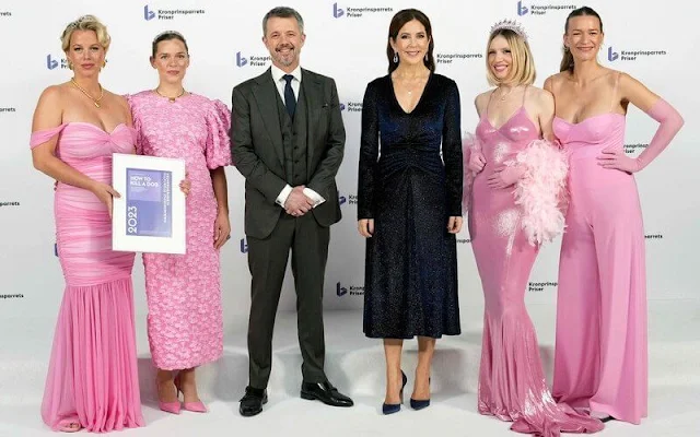 Crown Princess Mary is wearing a Rotate Birger Christensen velvet glitter midi dress. Gianvito Rossi pumps and Prada clutch