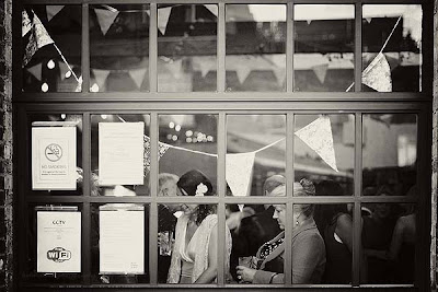 bride and guests through the window at St Chads place wedding