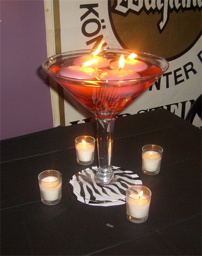 My table had a giant martini glass with pink water and floating candles