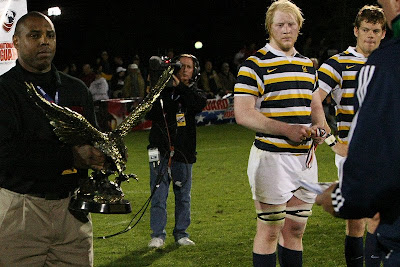 Cal Rugby standouts, Eric Fry and Keegan Engelbrecht, look on as BYU receives the coveted National Championship trophy