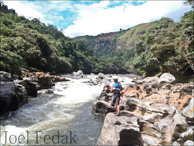 Chris Baer Scouting the entrance rapid on the Estrecho section of the Rio Magdalena, Colombia, Joel Fedak