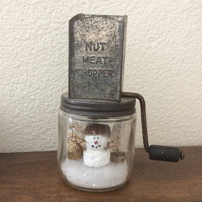Snowman in a nut grinder