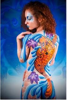 body paint koi fish in the paste on the sensitive part of woman's body