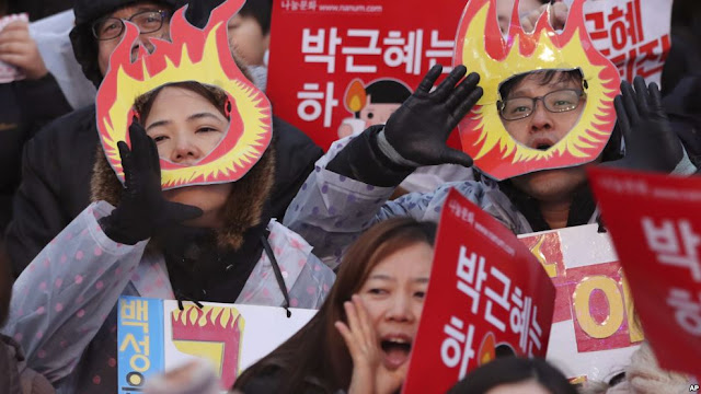 South Korean protesters shout slogans during a rally calling for South Korean President Park Geun-hye to step down in Seoul, South Korea, Nov. 26, 2016.