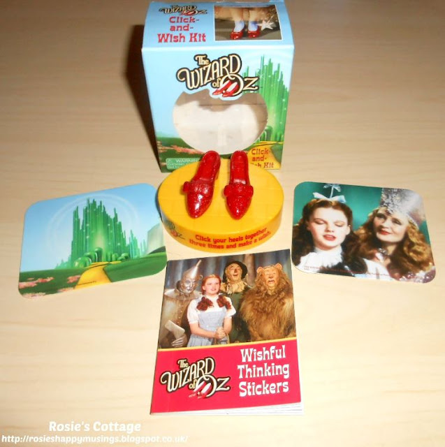 The Wizard of Oz Click and Wish Kit: contents include two mini "backgrounds" for the piece of yellow brick road (including Dorothy's ruby slippers) and a little book of stickers