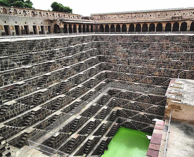 an ancient public well in India, color photograph