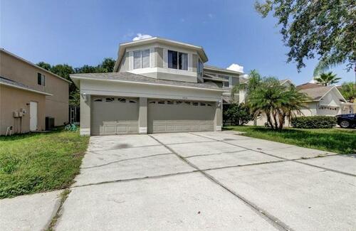 A six-bedroom, three-bath, single-family home in Tampa, Fla., listed for $600,000.