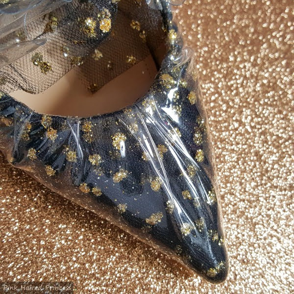 close up of pointed toe shoe in polka dot tulle and pvc