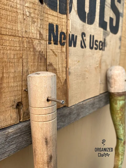 Photo of a pallet sign stenciled with a garden tools stencil