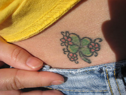 How To Kiss A Girl On Stomach. flower tattoo on stomach.