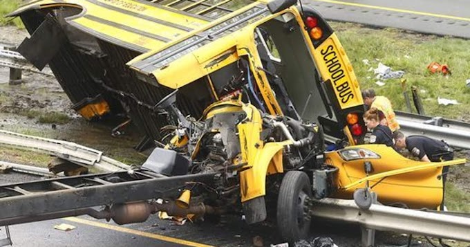 Four killed as school bus mounts pavement, trapping passers-by