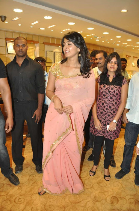 Anushka Shetty in Mustard Saree and Golden Blouse in a Shopping mall images