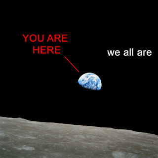 a picture of the Earth as seen from the moon, with the words "You are here" and "we all are."