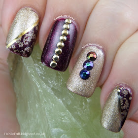 An elegant gold and purple nail art look.