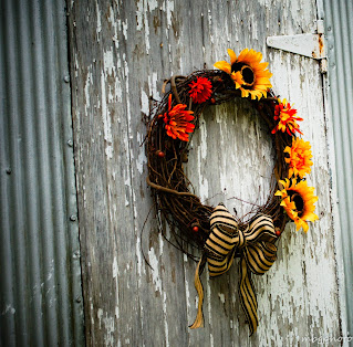 wreath on old wood barn door photo by mbgphoto