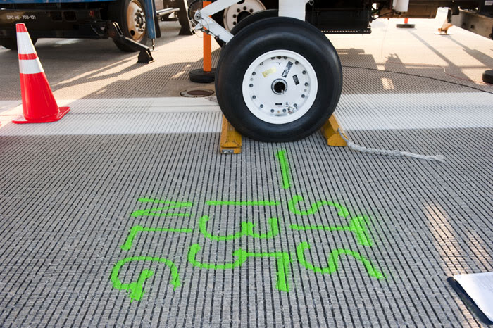 At KSC's Shuttle Landing Facility, the location where Atlantis' nose landing gear came to a final stop is marked for historical purposes, on July 21, 2011.