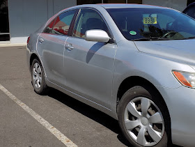 Damaged Camry after collision repair at Almost Everything Auto Body.