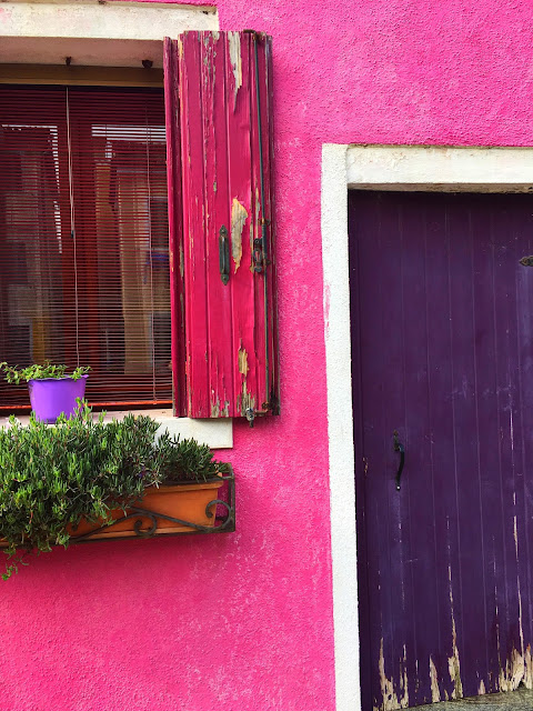pink house in burano, italy