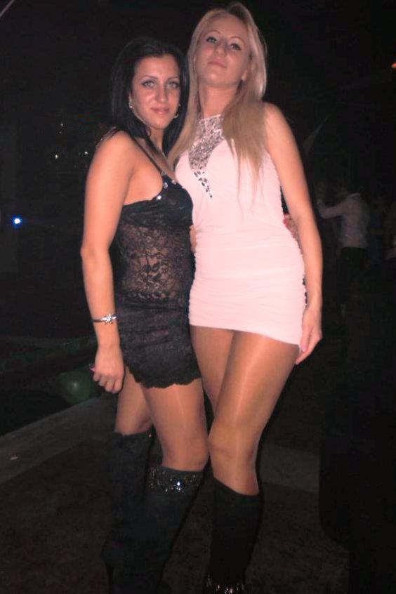 Women in mini dress, tights and boots