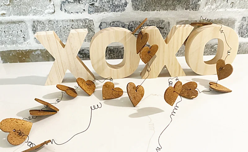 xoxo blocks with a wired rusty heart garland