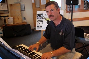 Peter Littlejohn having a go on the Korg Pa3X. Photo courtesy of Dennis Lyons
